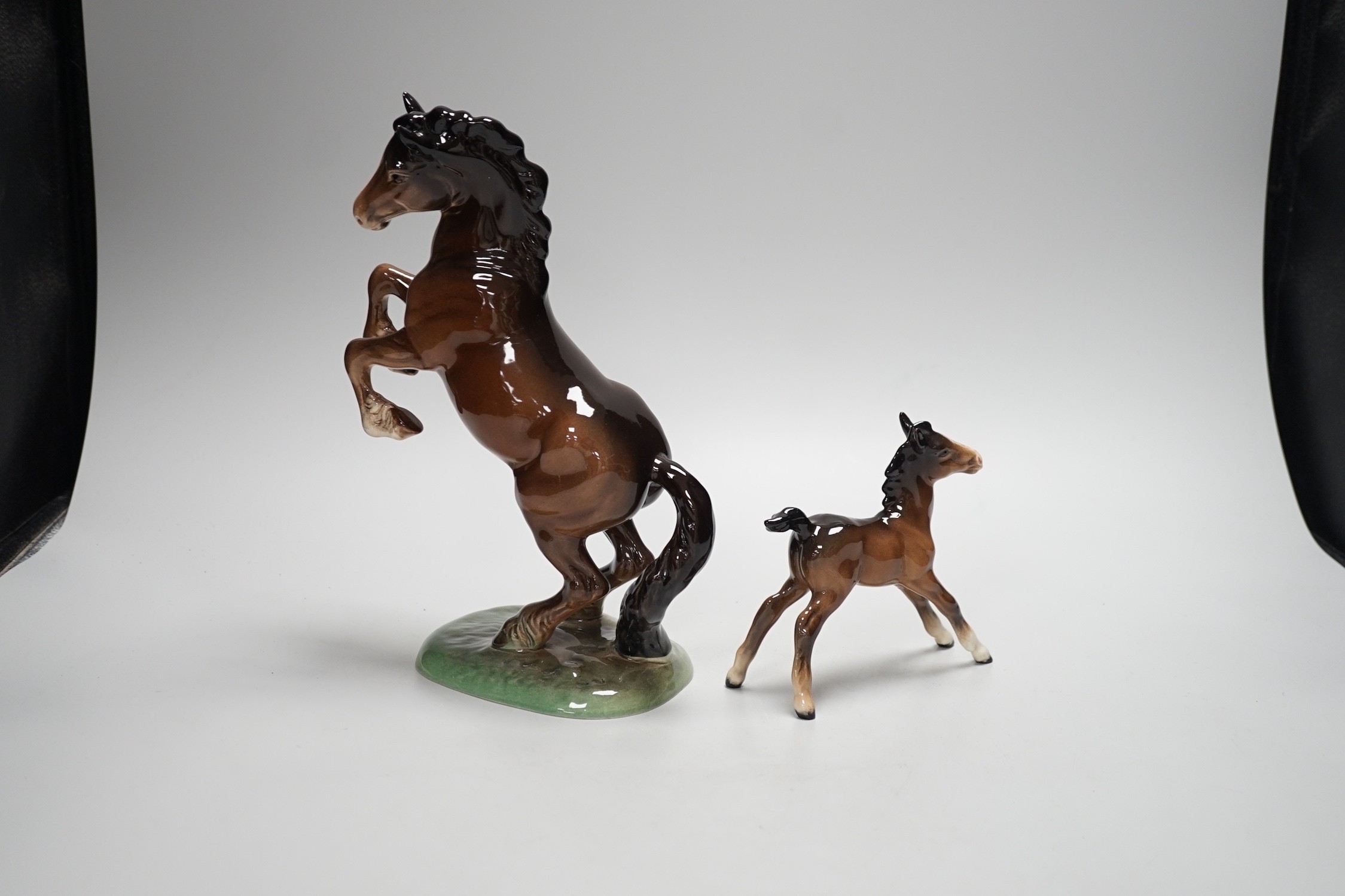 Two Beswick models of horses, one rearing and the other a foal. Tallest 27cm